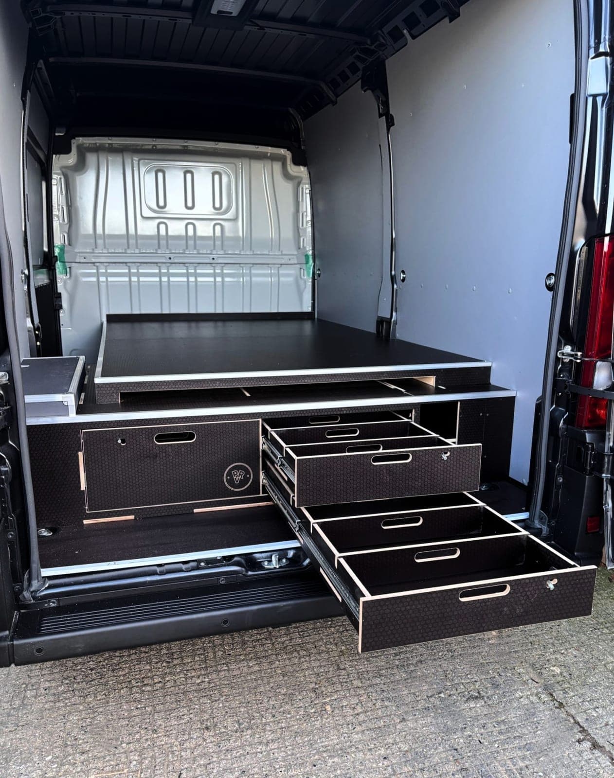 False Floor with Integrated Sheet and Drawer Storage — image 1