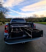 Pickup truck tool drawer system with slide-out work surface above left drawer by Ply Van Racking Ltd