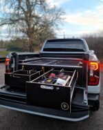 Custom pickup truck storage drawers open displaying organised power tools and equipment by Ply Van Racking Ltd