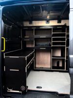 Bulkhead workbench fitted inside van with shelving above by Ply Van Racking Ltd