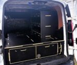 Small van storage system showing toolboxes secured in divider racking above drawers by Ply Van Racking Ltd