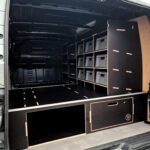 Versatile van drawer and racking system with raised floor pull-out drawer and shelving layout by Ply Van Racking Ltd